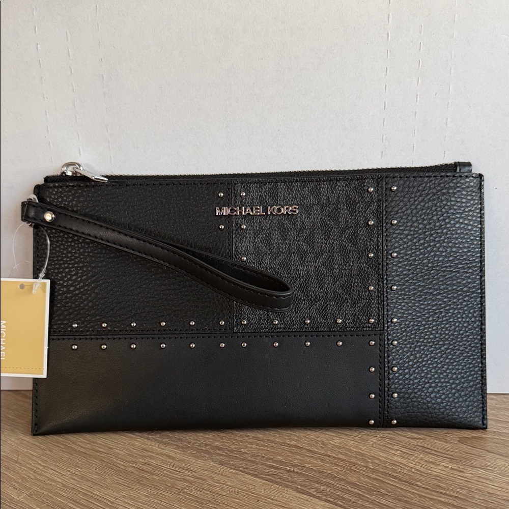 Michael Kors Large Jet Set Travel wristlet bag with patches, studs